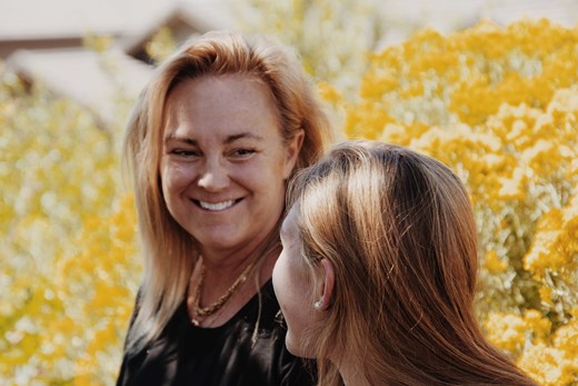 Mother looking at daughter smiling